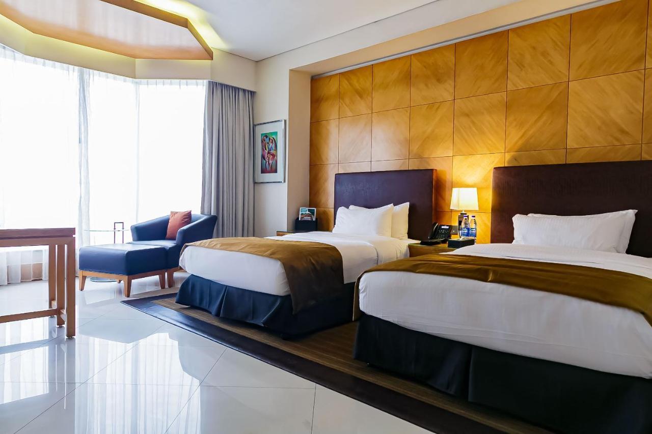 Lagos Continental Hotel Bagian luar foto Deluxe Room